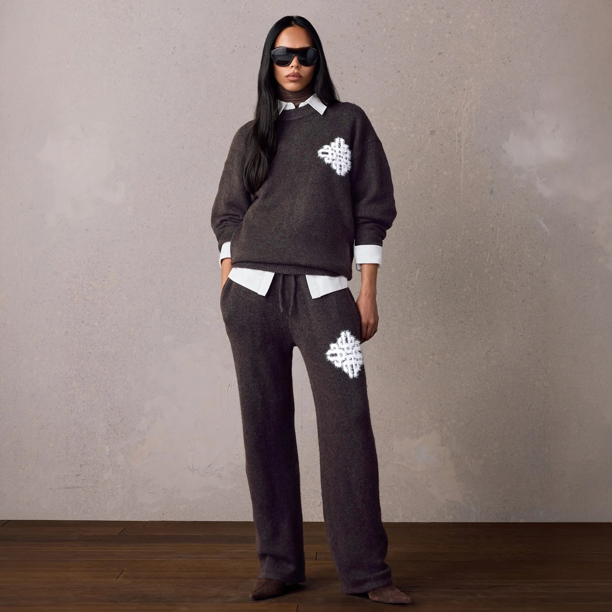 Model View of The Couture Club Emblem Fluffy Knit Brown Sweatpants